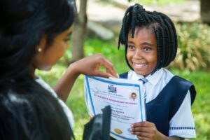 a girl holding a diploma
